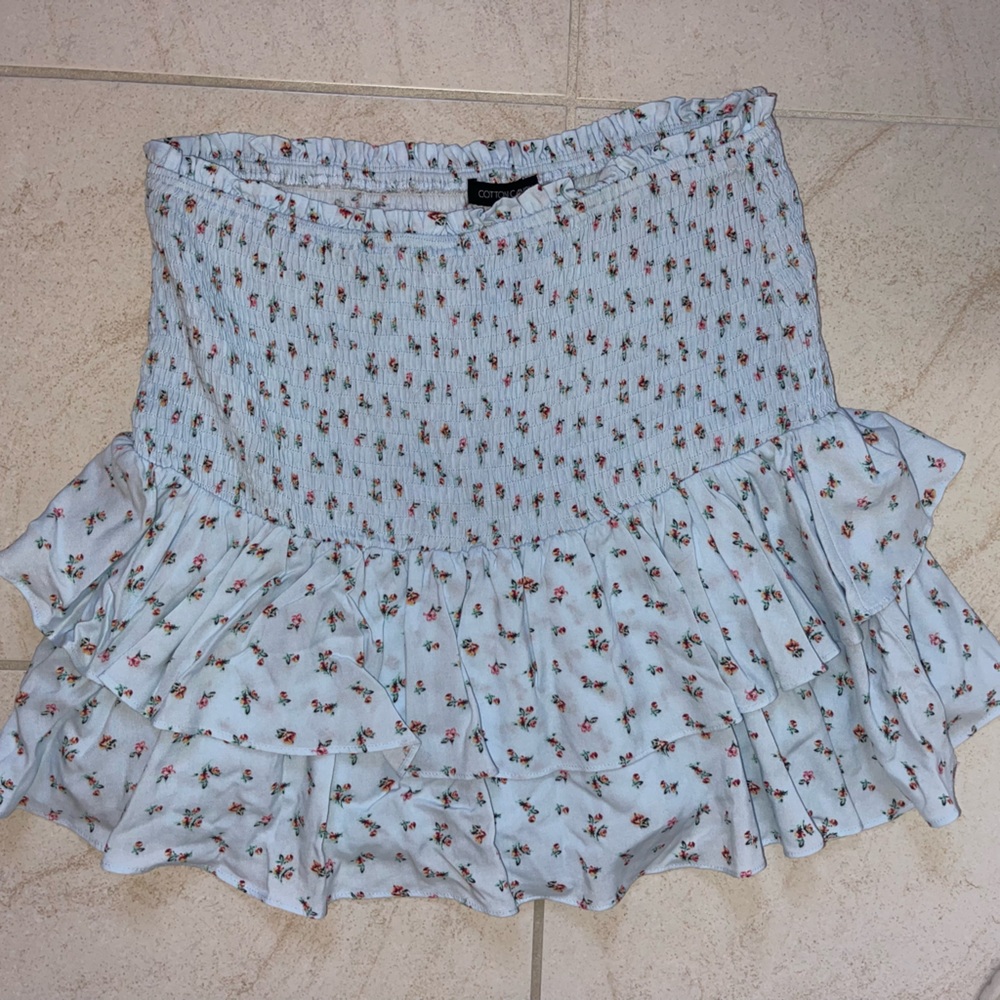Blue skirt with built in shorts, flower design and elastic waistband